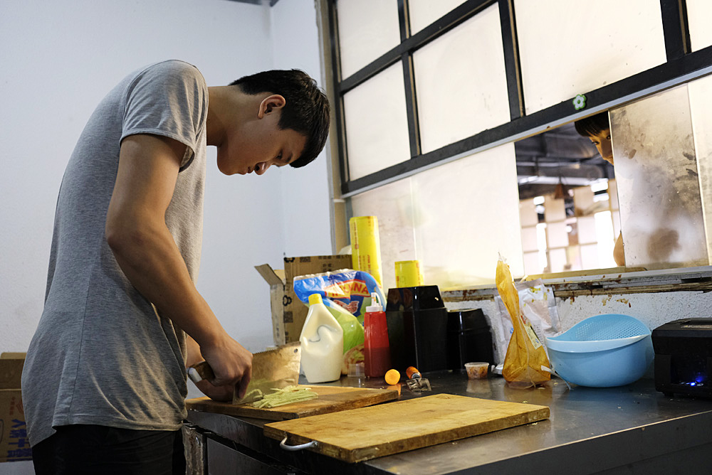 Xia Tian, 19, works in the kitchen of a Korean restaurant near Sichuan University in Chengdu.