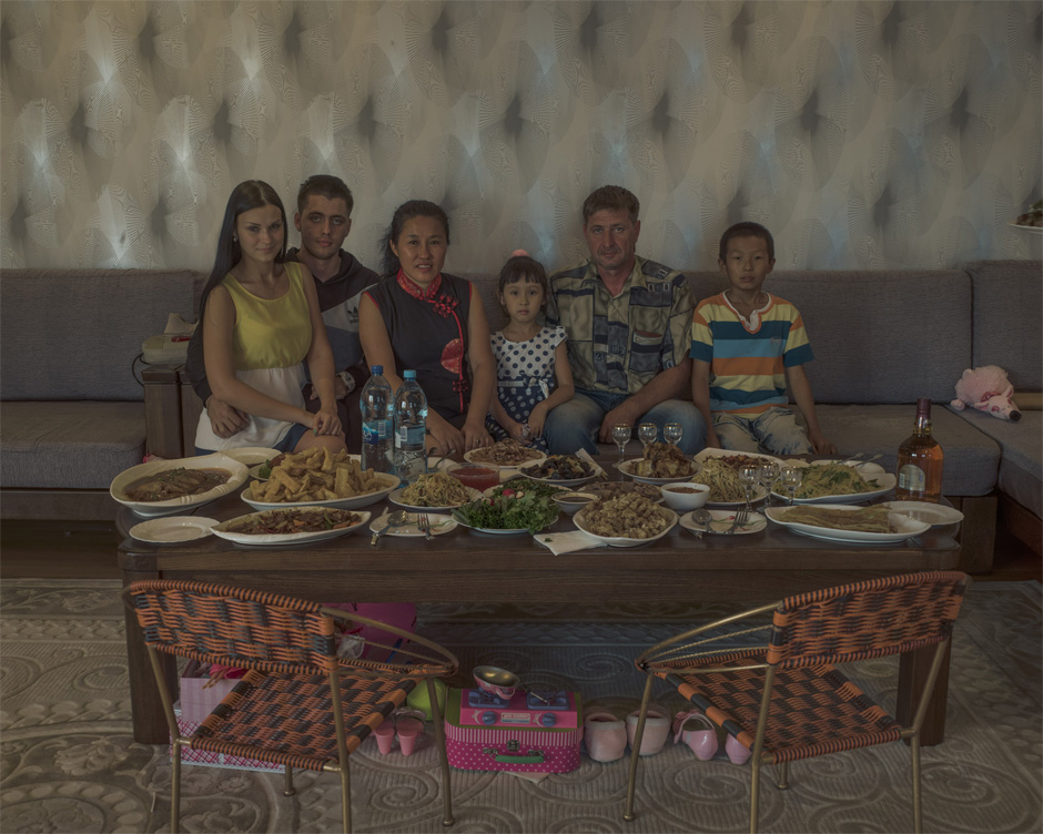 Li Lihua and her husband Vadim sit with family members in their Blagoveshchensk home. Li moved to Russia from Harbin in 1993 after the Soviet era ended and migration was once again possible. Today, she runs a successful business in construction and restoration. Prior to the mid-19th century, most Chinese migrants to Russia were convicts, hunters, fishermen, or traders.
