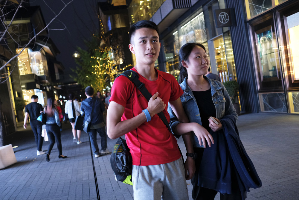 Bo Junhui, 18, shops with his sister on Chunxi Road in Chengdu.