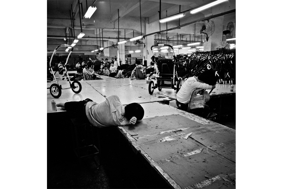 Near the end of a shift, some workers rested on the factory floor.