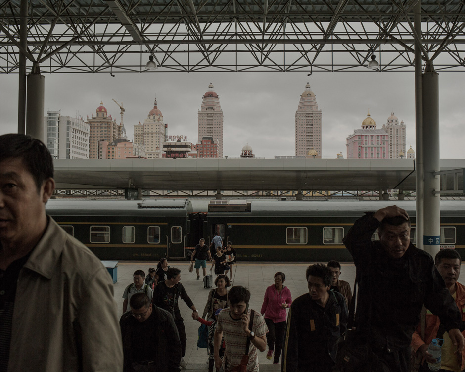 Passengers disembark at the Manzhouli railway station.