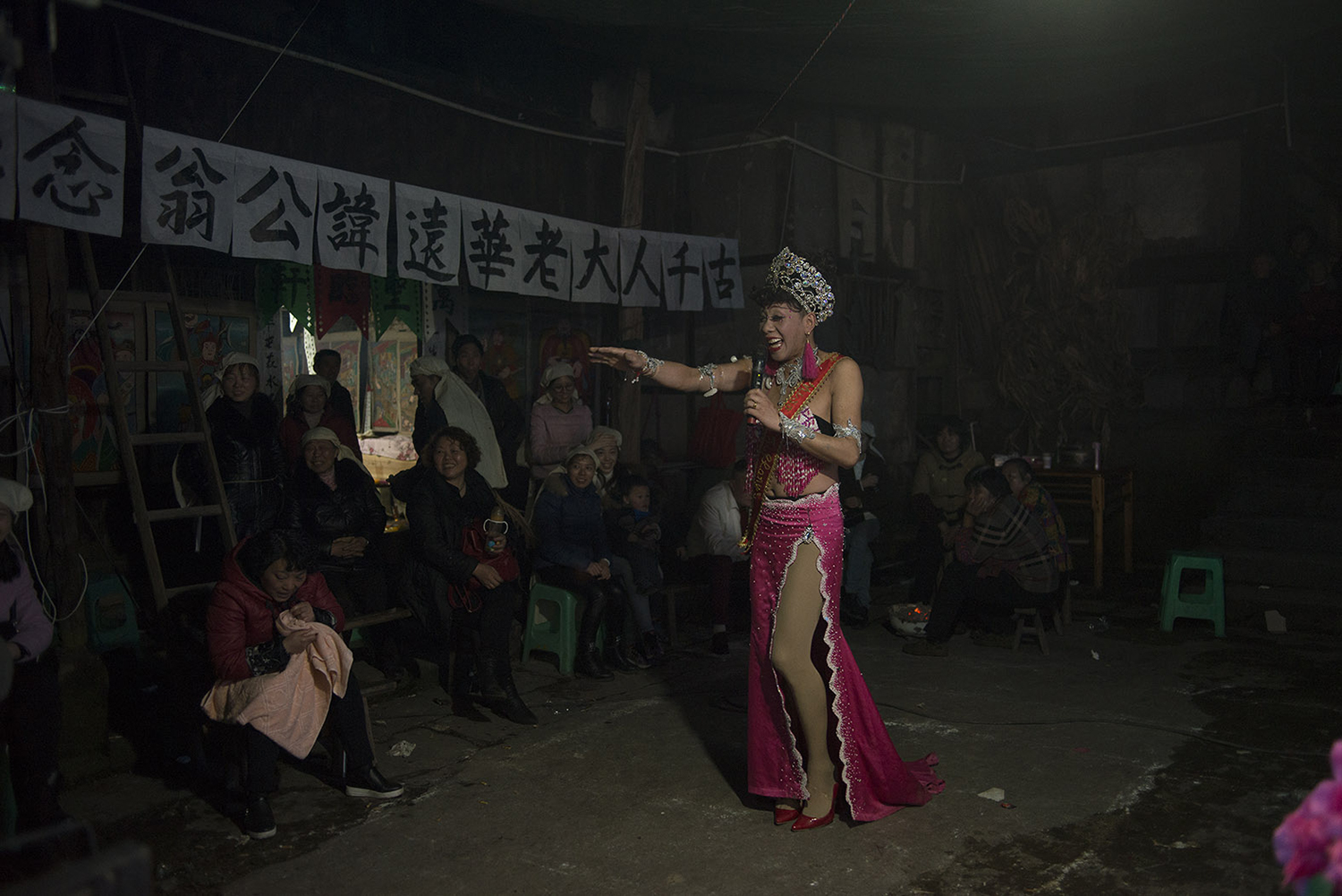 Drag queen Lala, 42, performs at a funeral in Qijiang district of Chongqing municipality, February 28, 2017. Lala is a friend of Liangzi, and she became a funeral performer around 2002.