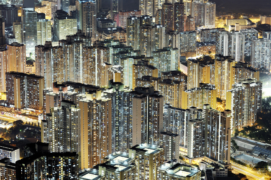 View of Hong Kong from Lion Rock, which overlooks Kowloon from the North, November 2011. Almost half of Hong Kong’s population lives in public or government-subsidized housing. Lit up at night, the glowing public estate blocks are hard to distinguish from high-end luxury towers.