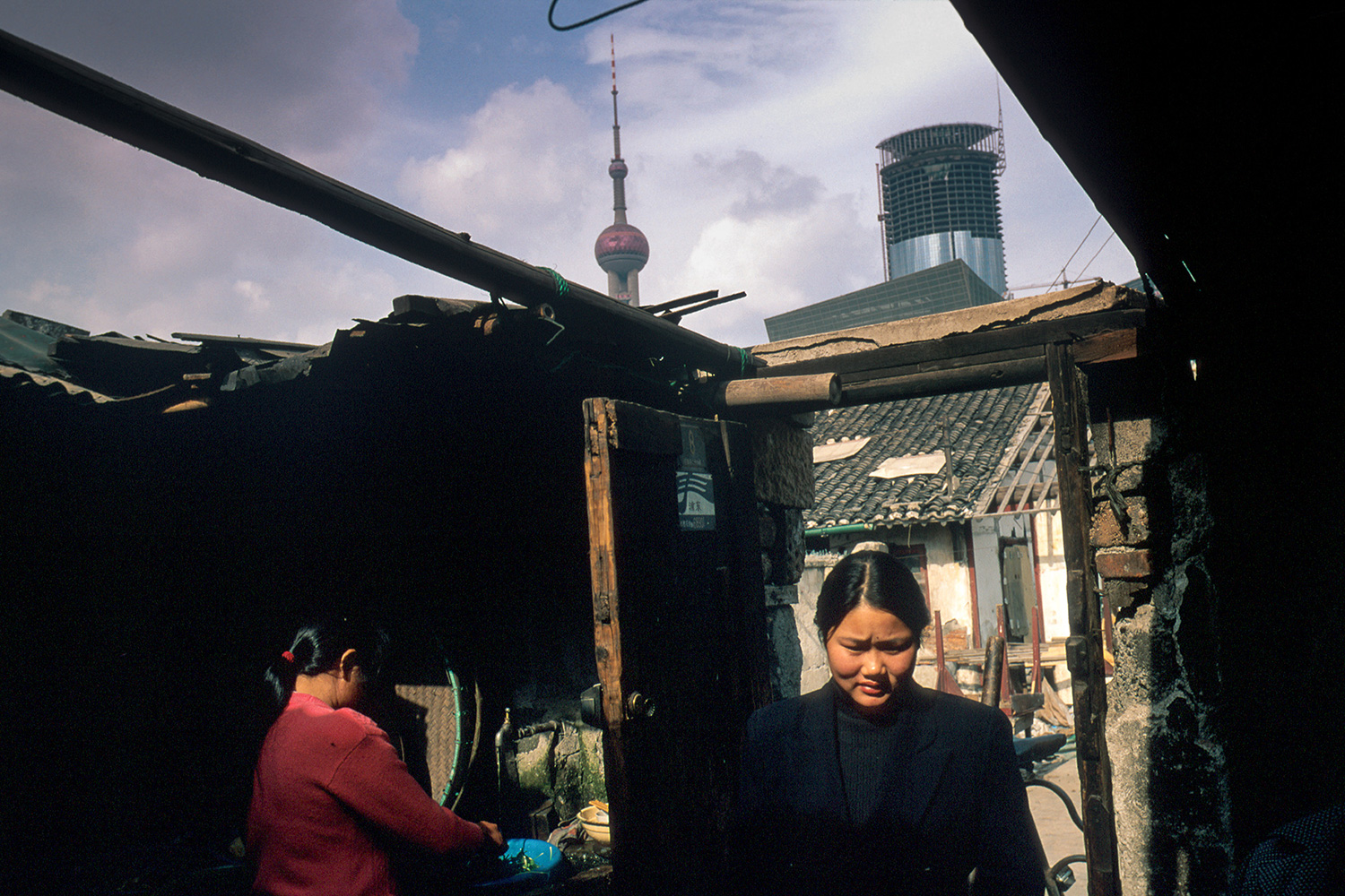 Homes vacated by residents to make way for construction projects were occupied by people from the countryside who came to Pudong to cater to the needs of construction workers, 1996.