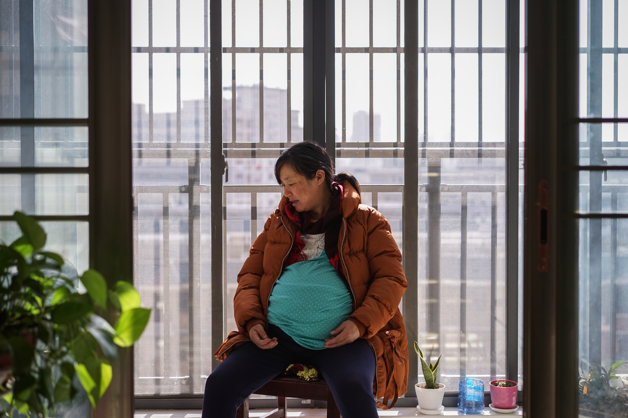 Zhiying rests at home in Suizhou, November 23, 2017. In addition to her age and emotional status, she faces another health challenge: 11 years ago, she suffered a cerebral infarction, a sudden blockage of an artery in her brain. IVF and pregnancy can increase the chance of blood clotting, which can be life-threatening. 