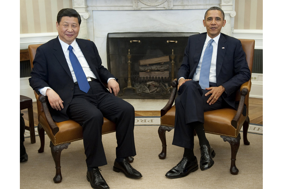 Chinese then Vice President Xi Jinping and U.S. President Barack Obama speak during meetings in the Oval Office of the White House in Washington, D.C., February 14, 2012. Obama received the Chinese leader-in-waiting following Xi’s meetings earlier in the day with Vice President Joe Biden and Secretary of State Hillary Clinton. (Photo by Saul Loeb/AFP/Getty Images)