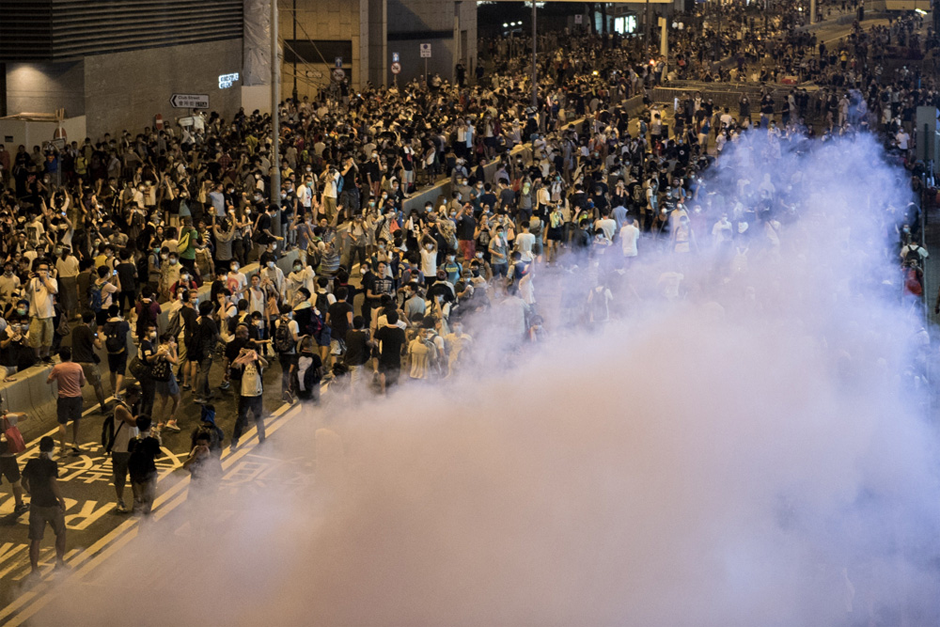 Police fire tear gas. (Photo credit by Alex Ogle/AFP/Getty Images)