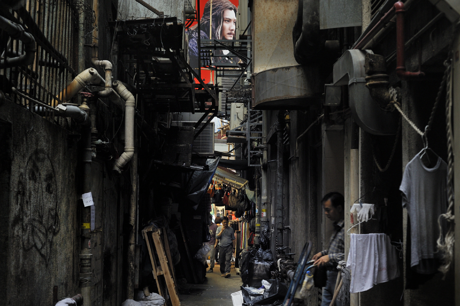 An ad for a Chinese movie above an alleyway in the Tsim Sha Tsui district.