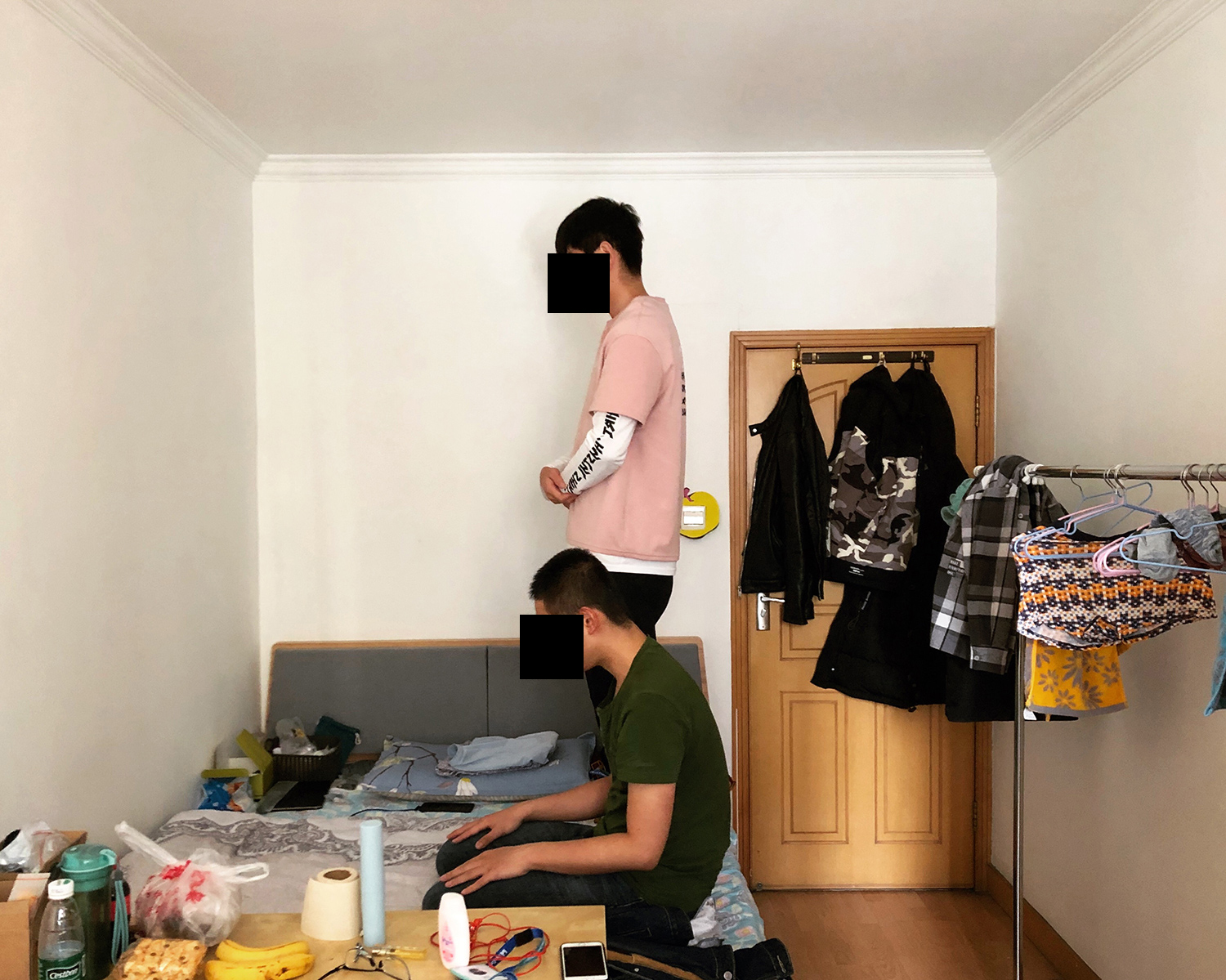 Umar (front) and Kashim (rear) pray at their rented apartment in Beijing, March 2019. After graduating from the University of Jordan, both of them started working at ByteDance, one of the highest valued private tech companies in the world,  as Arabic-language content moderators for the Chinese startup’s popular video app TikTok. Their daily work includes reviewing religious and politically-themed Arabic-language videos. 
