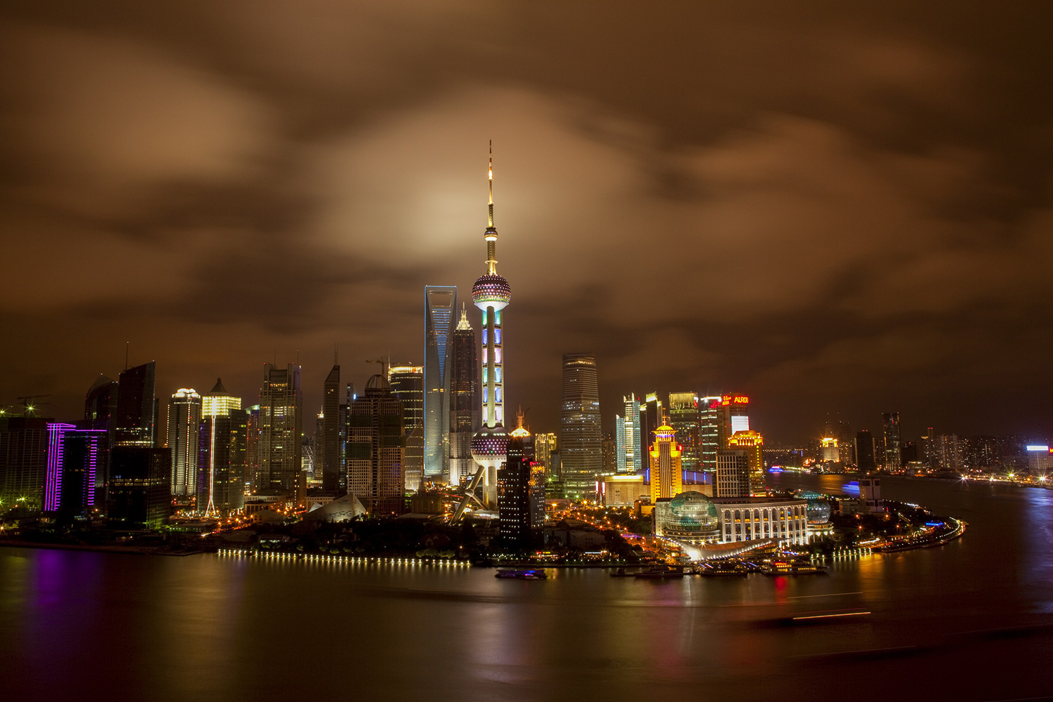 Images of Shanghai’s Pudong New Area skyline have been used often in both Chinese and western media as a symbol to illustrate stories about China’s economy, projecting an image of modern China. After Pudong was established as a special economic zone in 1993, construction sky-rocketed. Here it is 17 years later on a night in 2010.