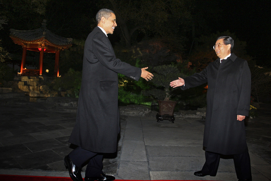 U.S. President Barack Obama is greeted by Chinese President Hu Jintao after his arrival at the Diaoyutai state guest house in Beijing on November 16, 2009. Obama arrived in Beijing from Shanghai for the second leg of his maiden state visit to China. Obama was welcomed at Beijing’s international airport by Vice President Xi Jinping (Photo by Elizabeth Dalziel/Pool/AFP/Getty Images)