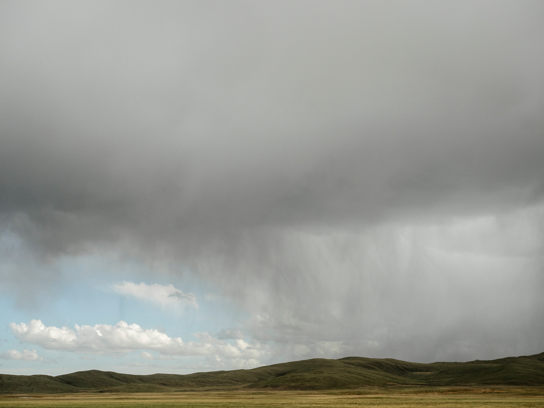 Rain clouds at an altitude above 13,000 feet, in Madoi county.