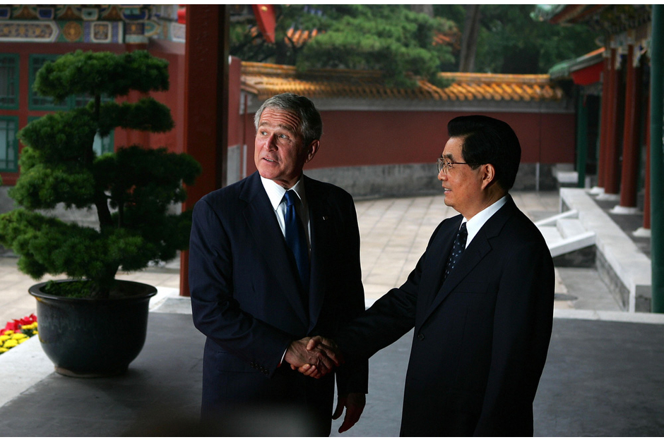 U.S. President George W. Bush is greeted by Chinese President Hu Jintao at the Zhongnanhai leadership compound in Beijing on August 10, 2008. On the same visit, President Bush attended a church service and urged China’s leaders not to be afraid of religious freedom. (Photo by Guang Niu/Pool/AFP/Getty Images)